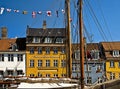 Copenhagen, Nyhavn, antique houses with bright colorful facades and old ships moored Royalty Free Stock Photo