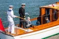 2011/06/21, Copenhagen. The Queen of Denmark Margaret II on a tender with sailors Royalty Free Stock Photo