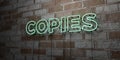 COPIES - Glowing Neon Sign on stonework wall - 3D rendered royalty free stock illustration