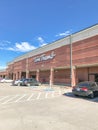 Entrance to Tom Thumb grocery store under cloud blue sky