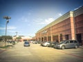 Filtered tone entrance of Tom Thumb grocery store under cloud bl