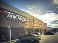 Filtered tone entrance of Tom Thumb grocery store under cloud bl