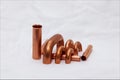 Copper accessories, objects for the industrial construction of heat exchangers for food refrigeration. Royalty Free Stock Photo