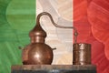 Copper alambik on the background of the national flag of Italy. Winemaking. Royalty Free Stock Photo