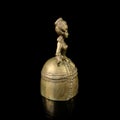 Copper antique bell in the shape of a girl in a magnificent dress.