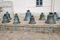 Copper bells on a white pedestal in the Kremlin, Moscow. Sights of Russia. Architecture of World