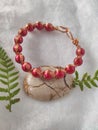 Copper bracelet with red beads Royalty Free Stock Photo