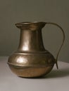 copper or brass antique handmade jug, isolated