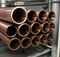 Copper bronze heat exchanger pipes. Heavy non-ferrous metallurgy. Factory industrial production of metal cuprum pipes