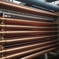 Copper bronze heat exchanger pipes. Heavy non-ferrous metallurgy. Factory industrial production of metal cuprum pipes