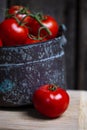 Copper bucket filled with ripe tomatoes Royalty Free Stock Photo