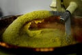 Copper cauldron with yellow polenta, typical dish from Northern Italy made with corn flour - italian food concept