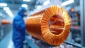 Copper coil component in industrial facility representing superconducting material, energy transfer efficiency and Royalty Free Stock Photo