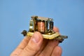 Copper coil switch in the hands of a master Royalty Free Stock Photo