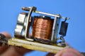 Copper coil switch in the hands of a master Royalty Free Stock Photo