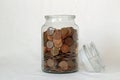 Copper coins in a savings jar Royalty Free Stock Photo