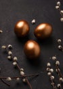 Copper-colored Easter eggs on a black background Royalty Free Stock Photo