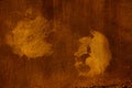 Copper colored wall texture background with textures of different shades of copper or bronze and the imprint of a hand Royalty Free Stock Photo