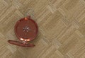 Copper compass isolated on wooden table