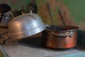 copper cookware and aluminum colander of a rural house without people