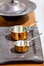 Copper cookware, pots and pans are on the counter in the store. Royalty Free Stock Photo