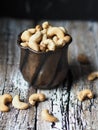 Copper cup full of cashew nuts