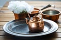 Copper old scratched vintage crockery kitchenware on the table