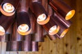 Copper cylindrical tubes chandelier Royalty Free Stock Photo