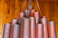 Copper cylindrical tubes chandelier Royalty Free Stock Photo