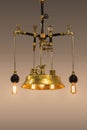 Copper design chandelier, golden color lamp, handmade from bronze, in steampunk style, isolated