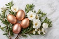Copper Easter eggs resting on white roses and green leaves Royalty Free Stock Photo