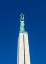 Copper figure of Liberty at the top of the Freedom Monument in Riga, Latvia