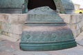 A copper fragment of the Tsar Bell next to a granite pedestal in the Kremlin, Moscow. Sights of Russia. Architecture Royalty Free Stock Photo