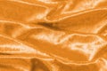 Copper gold velvet background or golden yellow velour flannel texture made of cotton or wool with soft fluffy velvety satin fabric