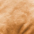 Copper gold velvet background or golden yellow velour flannel texture made of cotton or wool with soft fluffy velvety satin fabric