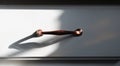 A Copper Handle on a White Drawer