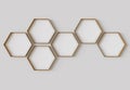 Copper hexagon blank photo frames mockup hanging on interior wall. Hexagonal pictures on painted surface. 3D rendering Royalty Free Stock Photo