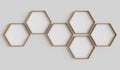 Copper hexagon blank photo frames mockup hanging on interior wall. Hexagonal pictures on painted surface. 3D rendering Royalty Free Stock Photo