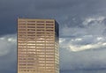 Copper High Rise Building On Cloudy Day