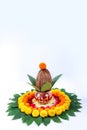 Copper Kalash with coconut , leaf and floral decoration on a white background. essential in hindu puja.