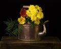 Copper kettle and flowers Royalty Free Stock Photo