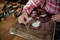 Copper master, hands detail of craftsman at work Royalty Free Stock Photo