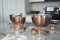 Copper measuring cups and bowls Royalty Free Stock Photo