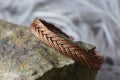metal wire elegant bracelet on rocky background