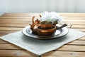 Copper old scratched vintage crockery kitchenware on the table