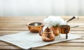 Copper old scratched vintage crockery kitchenware on the table