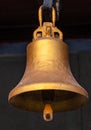 Copper old vintage bell. Decor concept element in the interior of a deck, cabin of a ship, restaurant, room, house Royalty Free Stock Photo