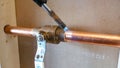 copper pipe soldering process with tin by specialized technicians Royalty Free Stock Photo