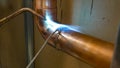 copper pipe soldering process with tin by specialized technicians Royalty Free Stock Photo