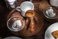 Greek coffee copper pot on a tray.